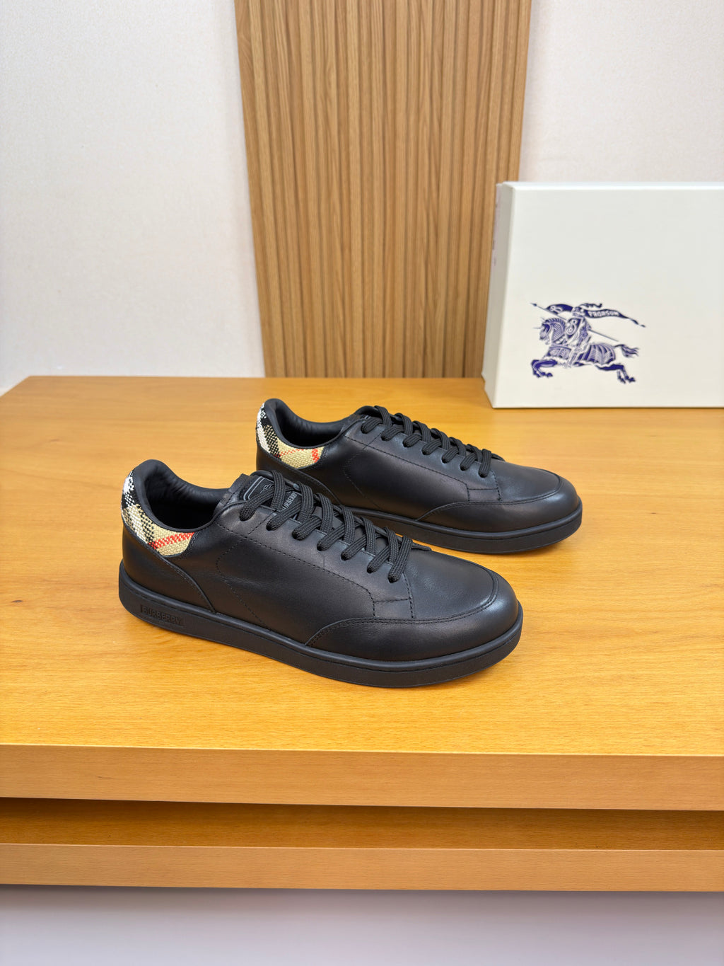 Burberry black leather sneakers with lace-up front and low-profile sole