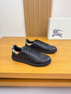 Burberry black leather sneakers with lace-up front and low-profile sole