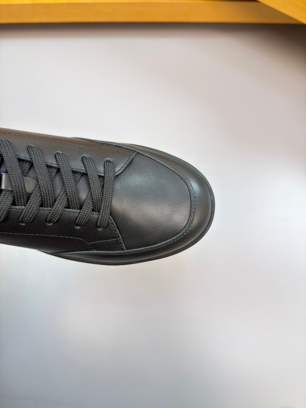 Burberry black leather sneaker toe and laces close-up with low sole