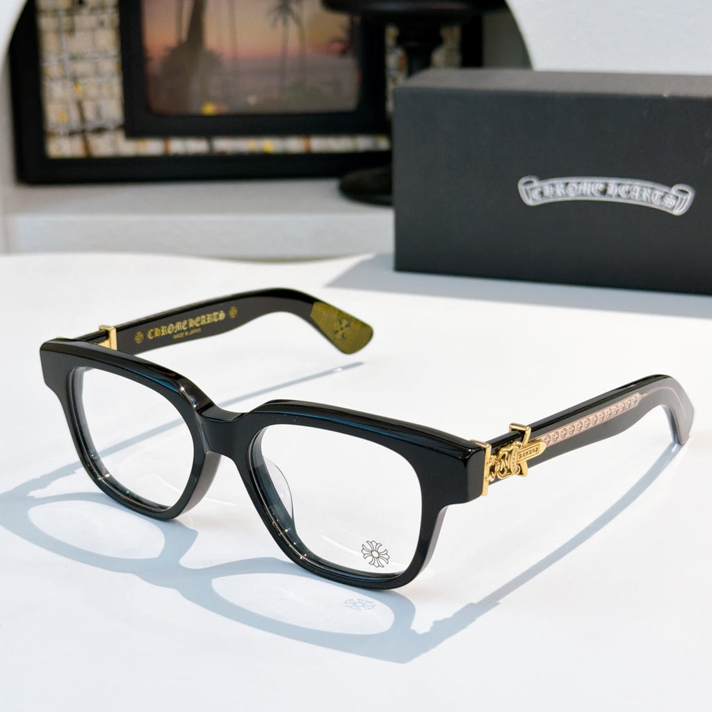 Black acetate eyeglasses with tortoise temple and gold-tone hinge detail