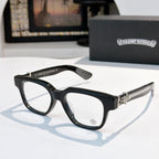 Black acetate eyeglasses with dark brown temple and small etched emblem