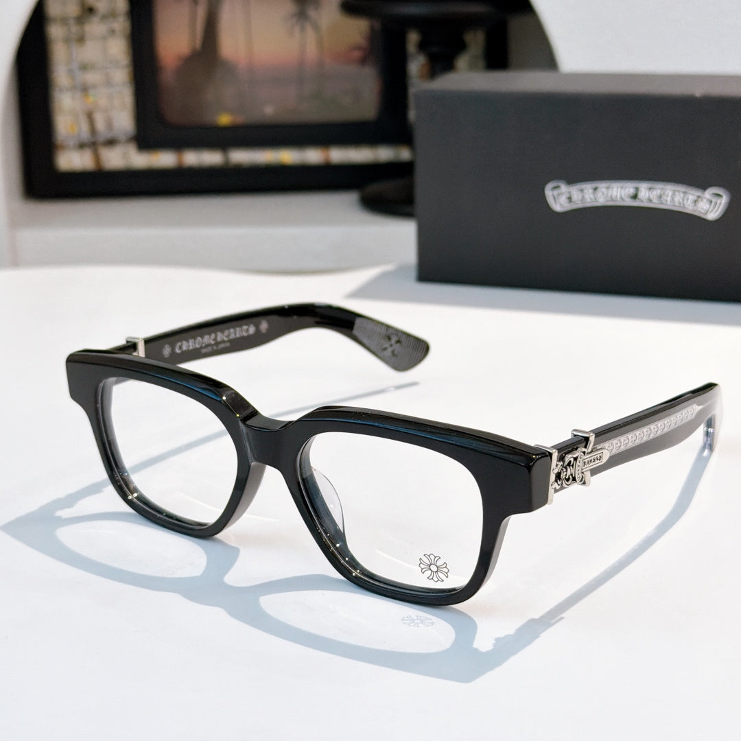 Black acetate eyeglasses with dark brown temple and small etched emblem