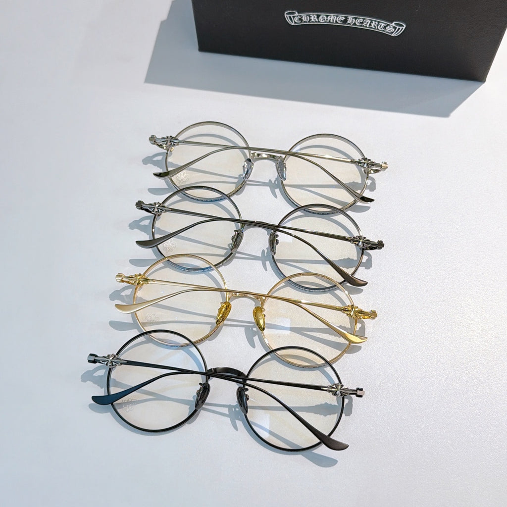 Assorted round eyeglasses set with chrome, gold, and dark frames displayed together.