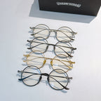 Assorted round eyeglasses set with chrome, gold, and dark frames displayed together.