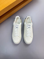 Pair of Burberry white lace-up sneakers, side view