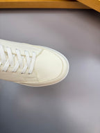 Burberry white sneaker toe and laces detail, close-up