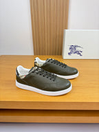Olive green leather sneakers, lace-up design with black laces and white rubber sole