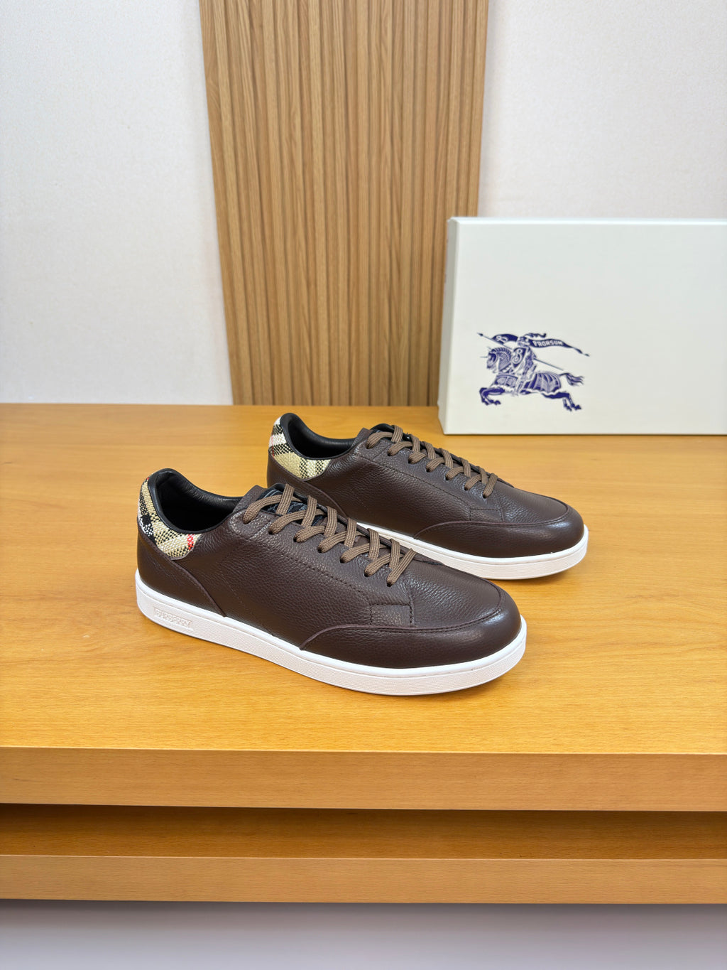 Brown leather lace-up sneakers with white sole and plaid collar lining