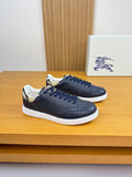 Navy lace-up leather sneakers with white rubber sole and check trim at the collar