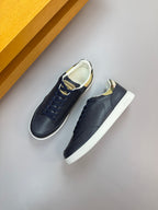 Navy low-top sneakers with white sole, side stitching, and check heel trim