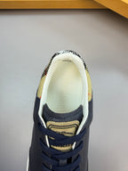 Inside view of a navy lace-up sneaker showing light lining and check-pattern trim