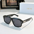 Black cat-eye sunglasses with dark lenses and silver-tone logo temple