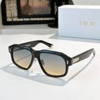 Black cat-eye sunglasses with amber-tinted lenses and gold-tone temple accents