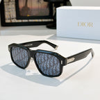 Black cat-eye sunglasses with blue logo-pattern lenses and gold accents