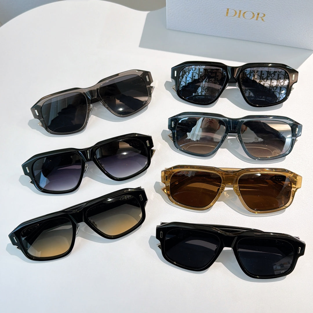 Assorted sunglasses in black, gold, blue, and brown with logo temples