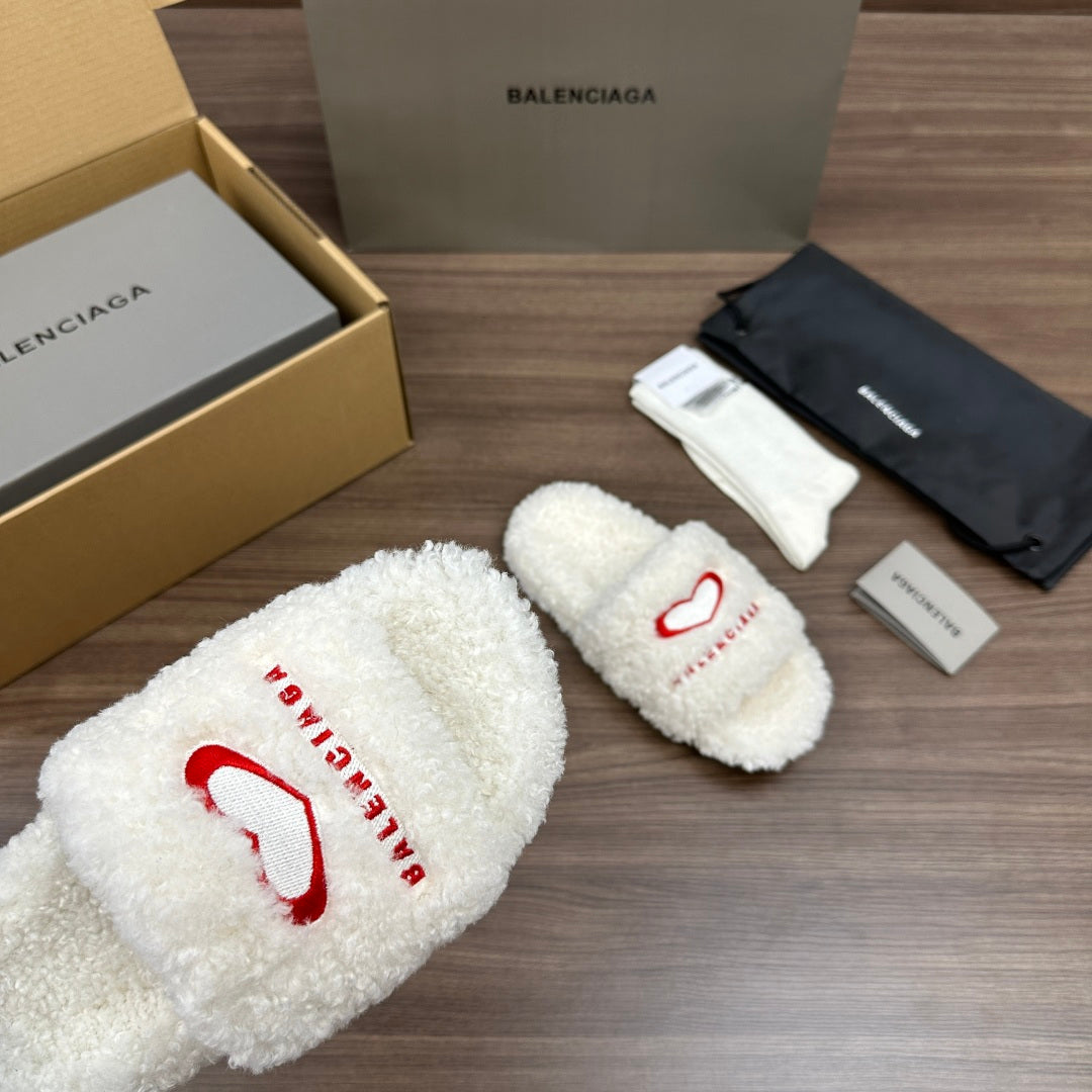 Balenciaga fuzzy white slide sandal with red logo on front strap