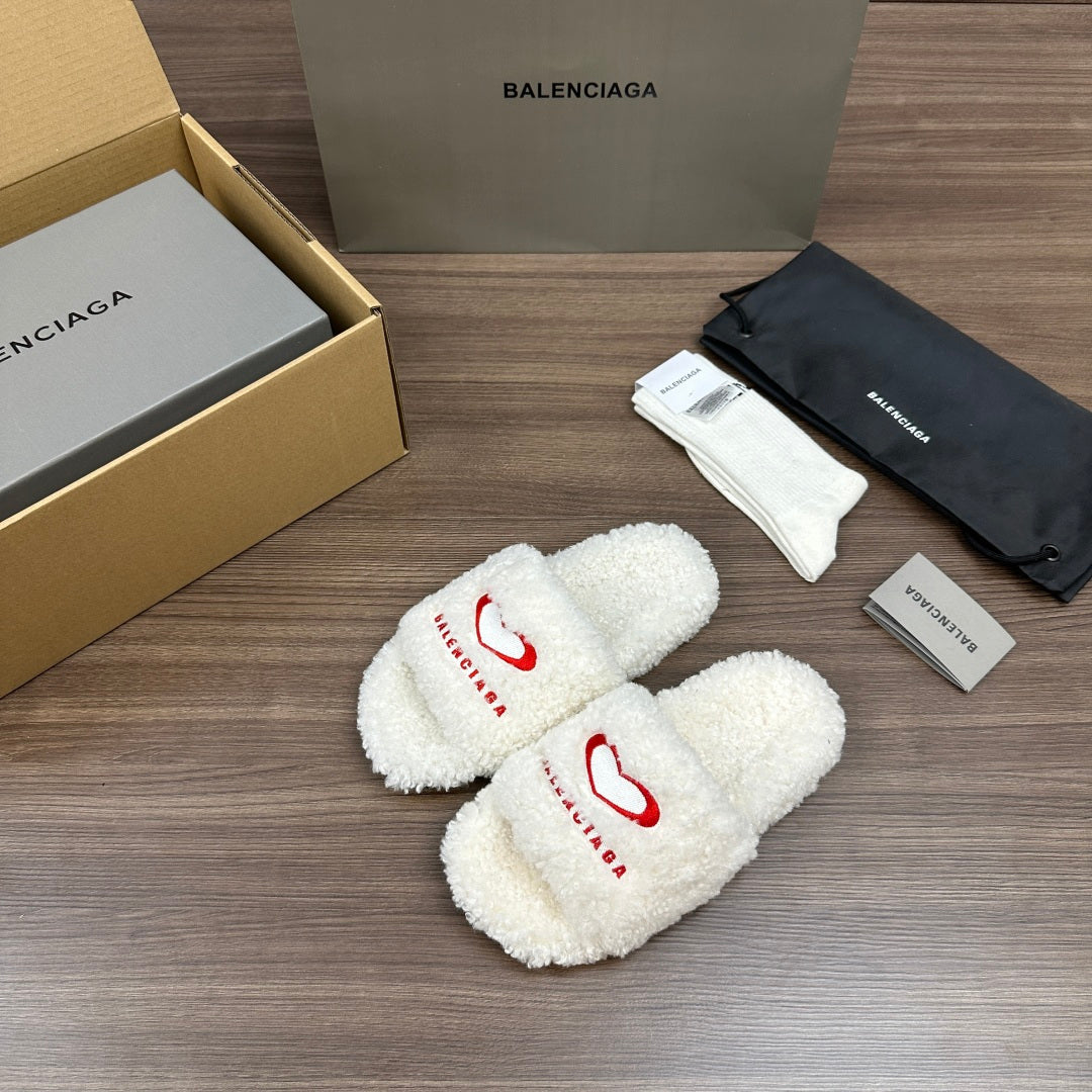 Balenciaga fuzzy white slide sandals with red logo on crossed straps