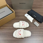 Balenciaga fuzzy white slide sandals with red curved logo on side