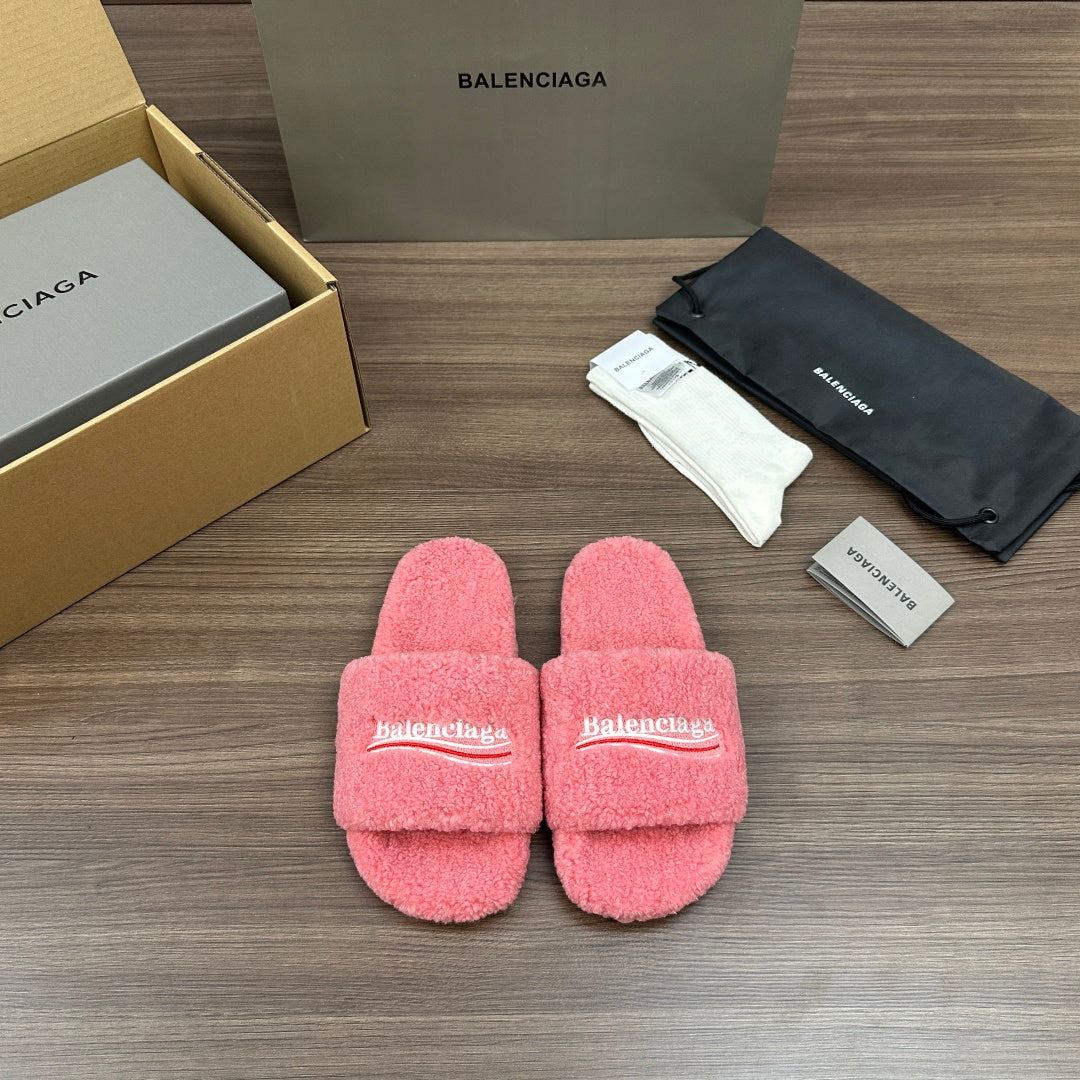 Pink terry slide sandals with Balenciaga logo strap, open toe, cushioned footbed.
