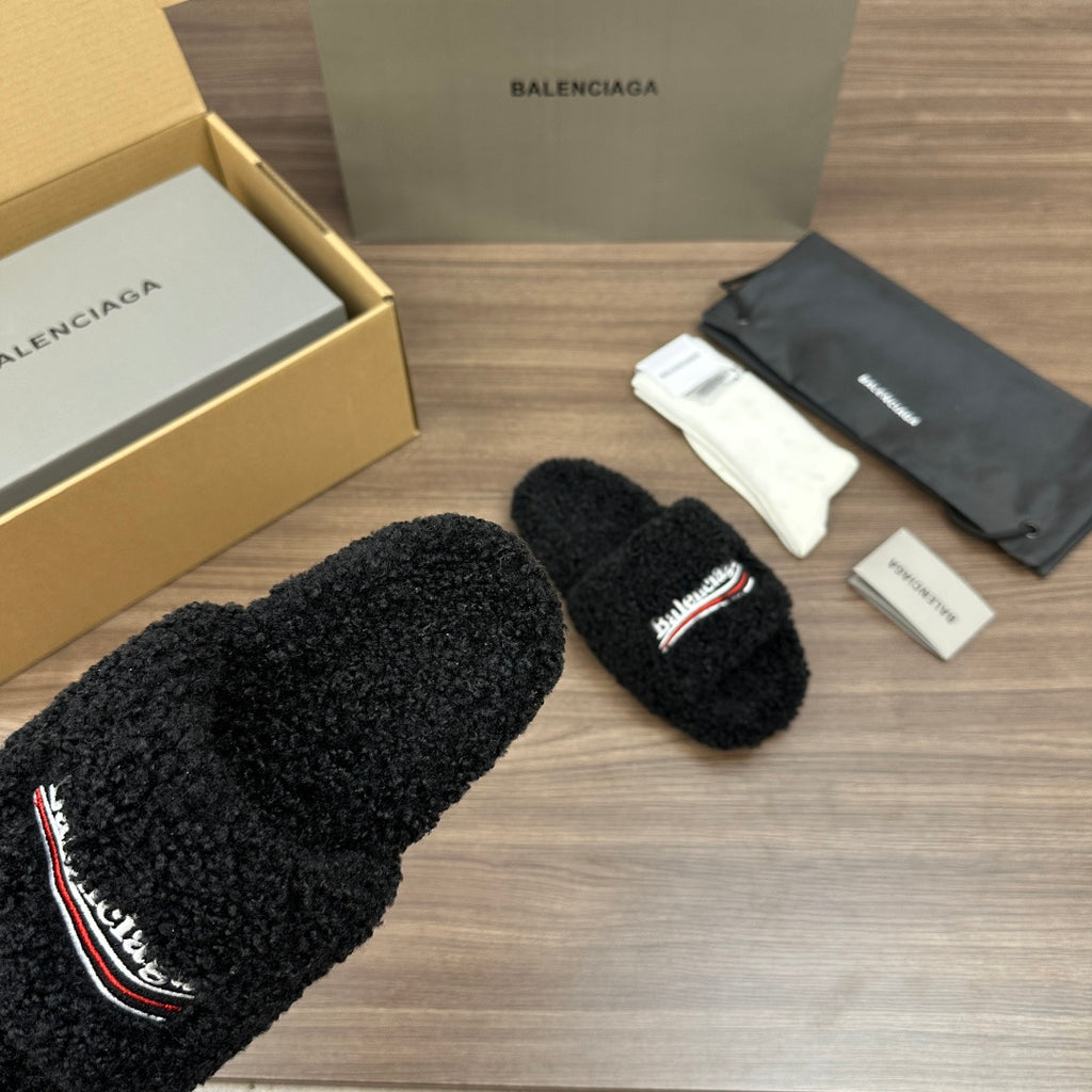 Black plush slide sandals with embroidered logo on strap, wide strap
