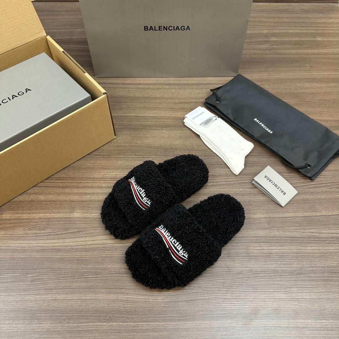 Black plush slide sandals with embroidered logo on strap, open toe