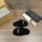 Black plush slide sandals with striped logo strap, open toe