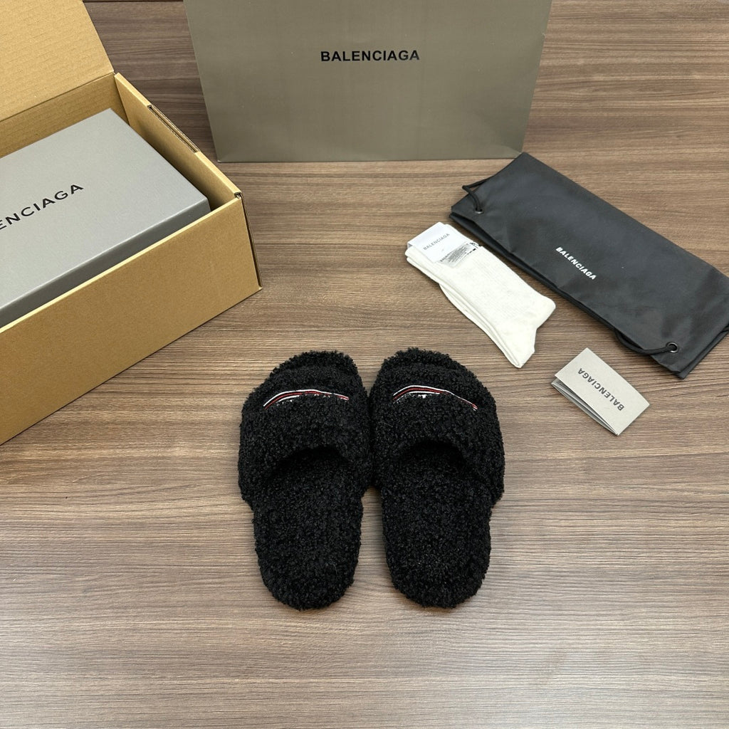 Black plush slide sandals, front view with red-white striped logo detail