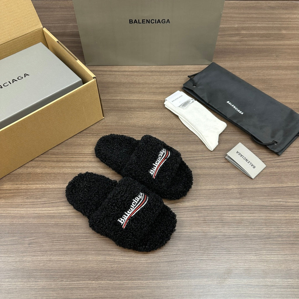 Black plush slide sandals with logo strap, textured fuzzy finish