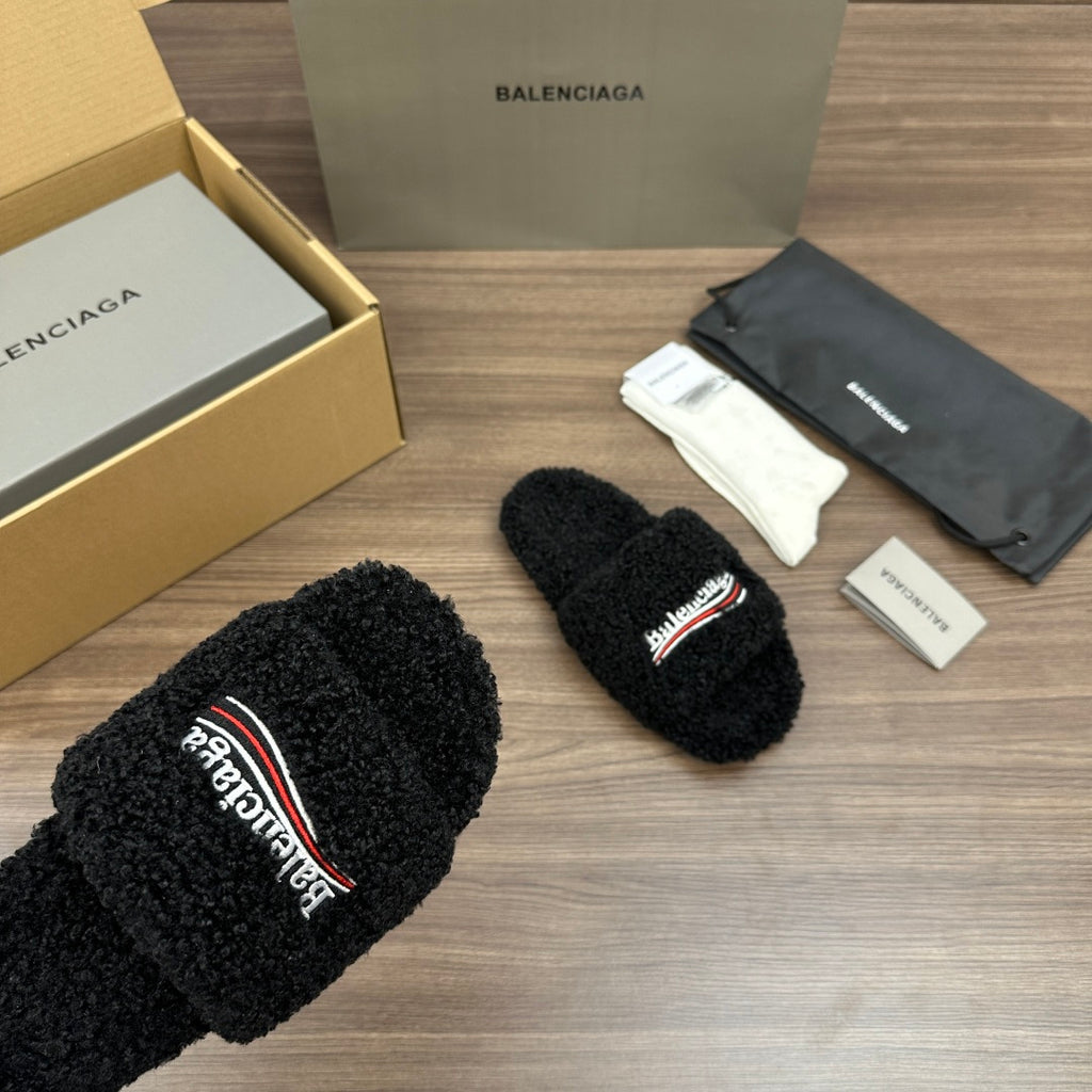 Black plush slide sandals with multicolor logo on strap, open toe