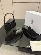 Black suede loafers with square strap buckle and chunky outsole