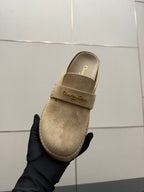 Beige suede mule loafer with front strap and Dior logo, close-up