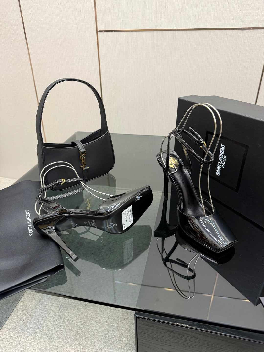 YSL ladies black patent heeled sandals with sculpted stiletto heel and ankle straps