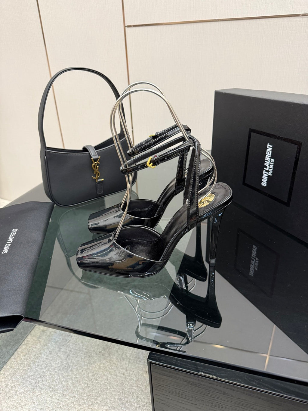 YSL ladies black patent heeled sandals with thin ankle straps and stiletto heel