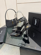 YSL ladies black patent heeled sandals with thin ankle straps and stiletto heel