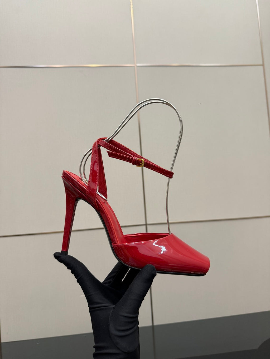 Red patent slingback stiletto heel with open side and thin ankle strap