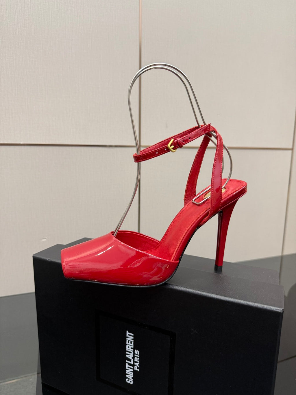 Red patent slingback stiletto heel with thin straps and pointed toe