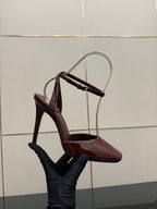 Burgundy patent stiletto sandal with open toe and ankle strap, side view