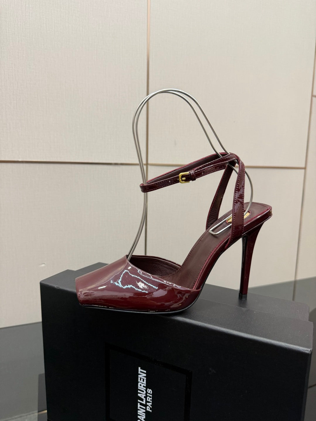 Burgundy patent stiletto sandal, open toe with ankle strap and metal buckle