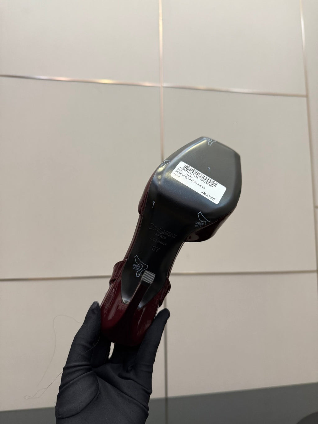 Burgundy high-heel sandal sole and heel, bottom view