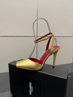 Women’s gold high-heel sandal with red insole and slim ankle strap