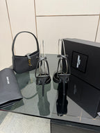 YSL black high-heel sandals with open toe, thin straps, and gold accent at vamp