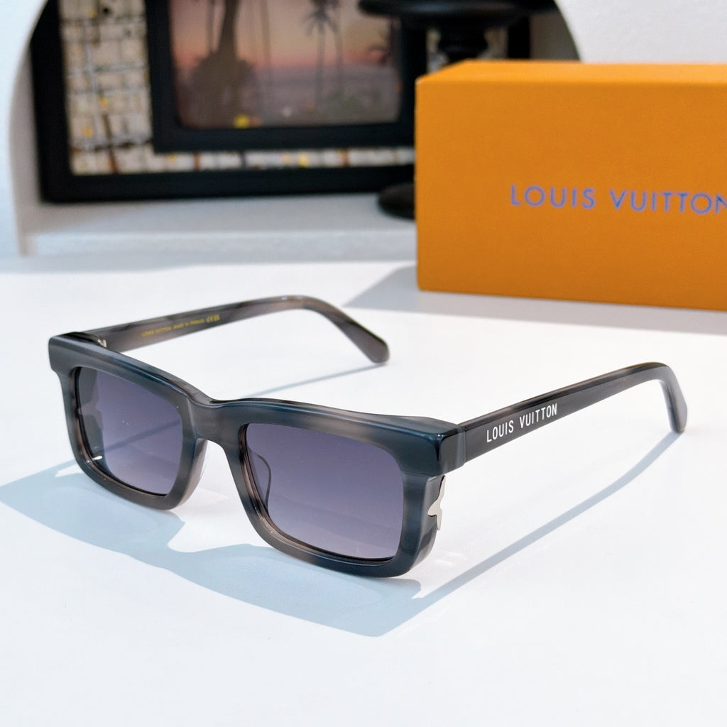 Louis Vuitton sunglasses with smoky gray frames and purple gradient lenses