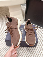 Brown unisex knit lace-up sneaker with white sole and lace-up front