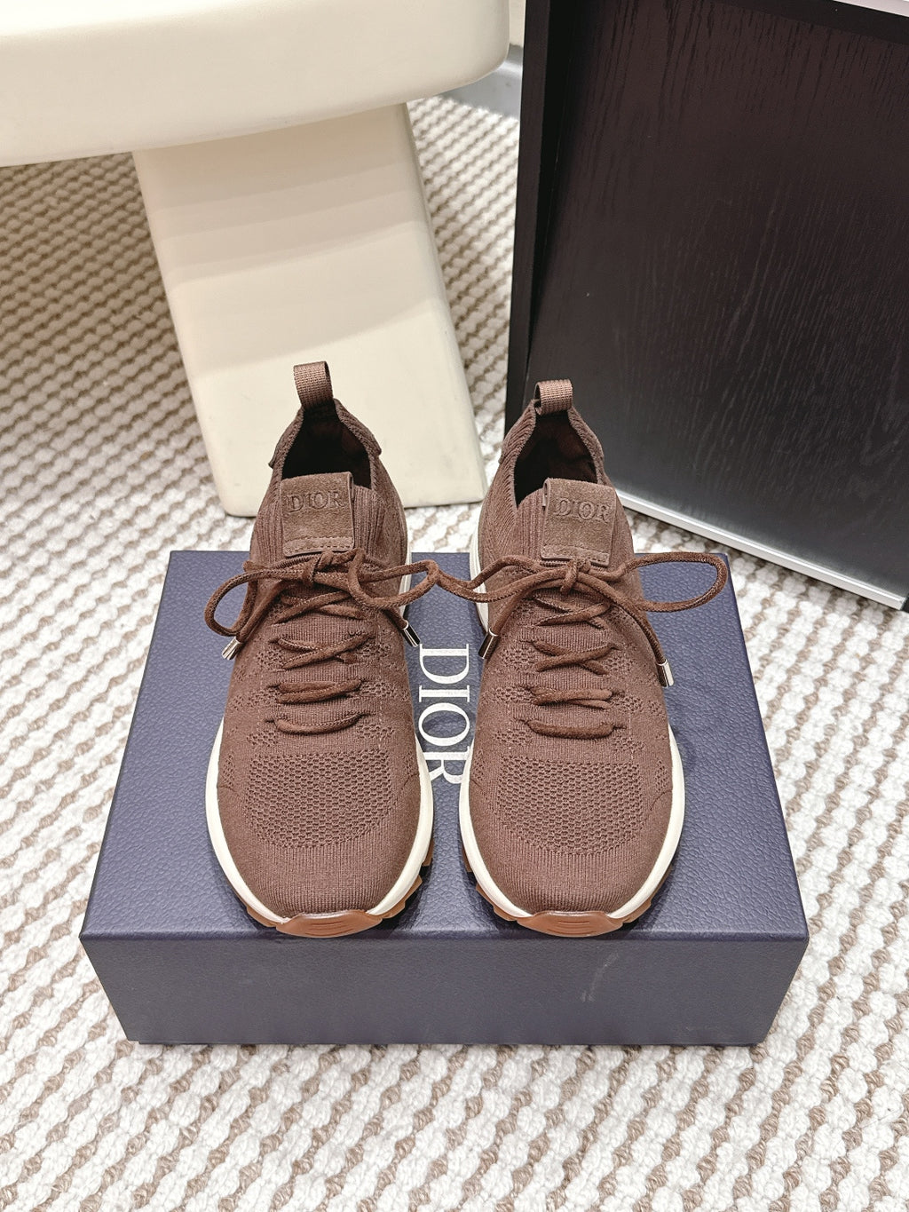 Brown unisex knit lace-up sneakers with cushioned sole and fabric pull tabs