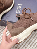 Brown unisex knit sneaker with lace-up front and side stitch detail