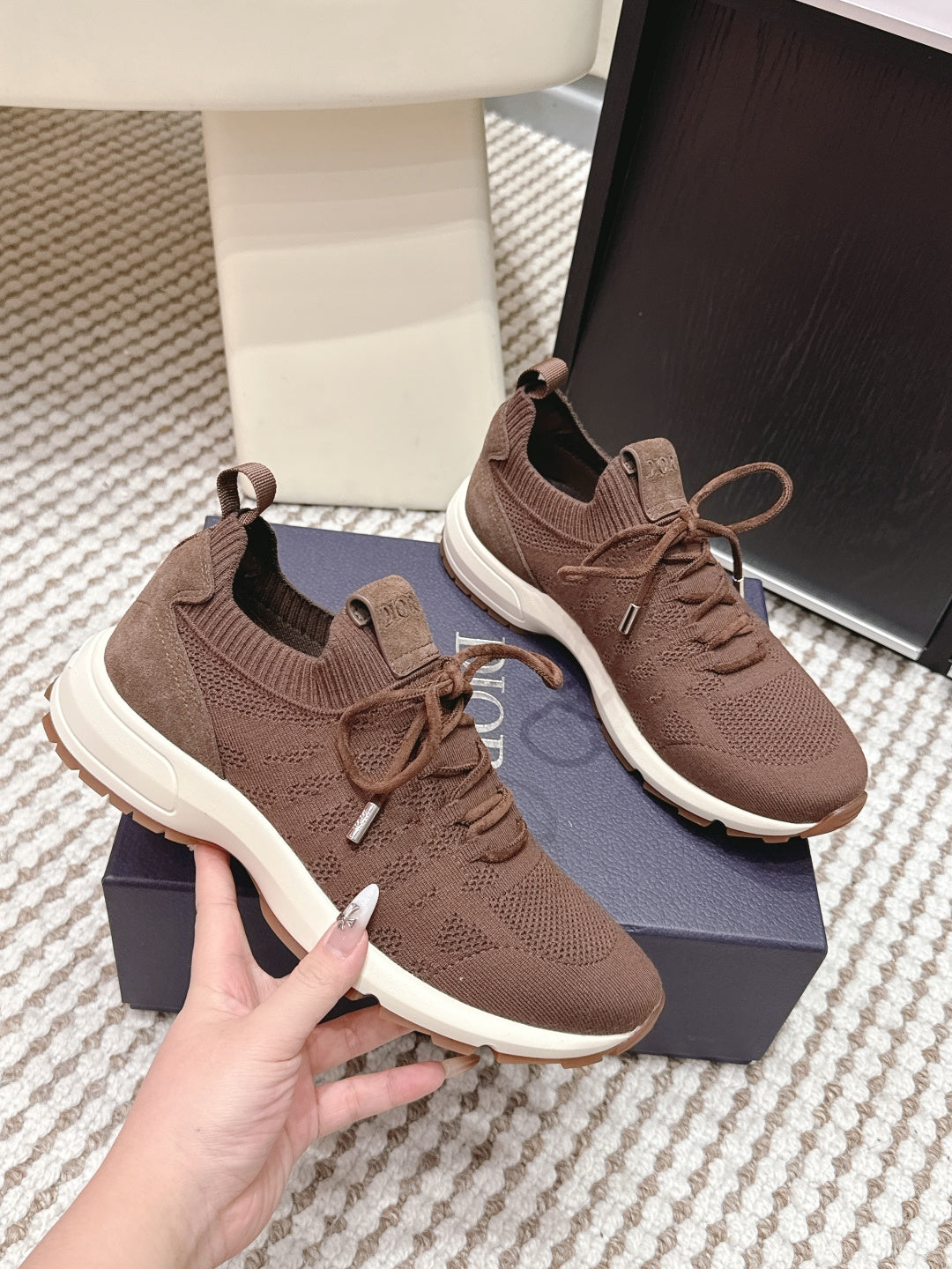 Brown unisex knit lace-up sneakers, side view, with white rubber soles