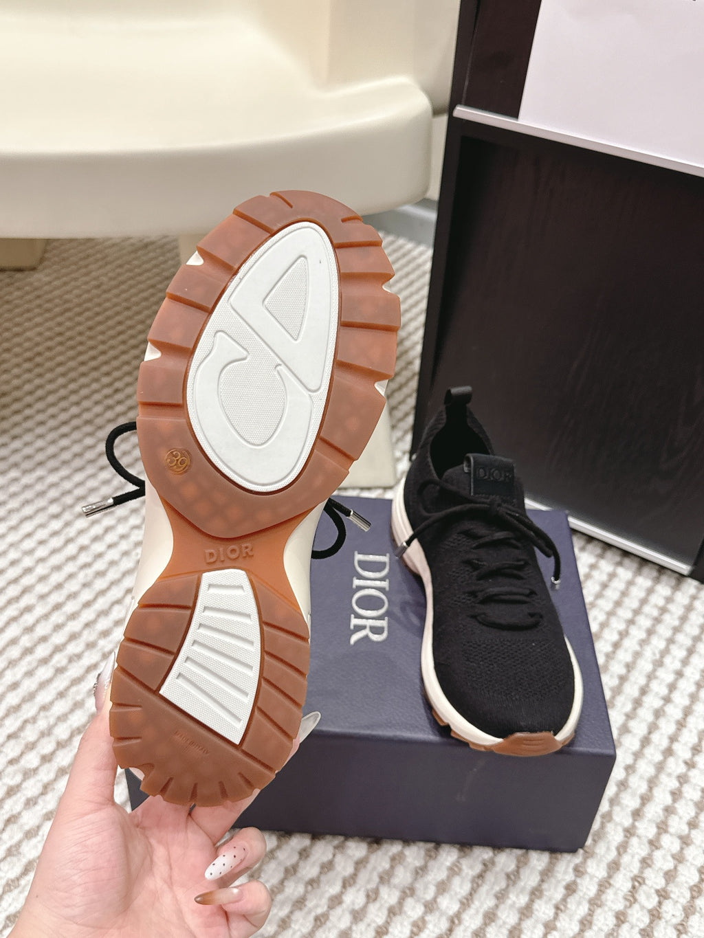 Pair of Dior unisex sneaker outsoles with brown tread and white details