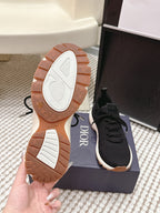 Pair of Dior unisex sneaker outsoles with brown tread and white details