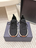 Black Dior unisex sneakers with lace-up front and white rubber sole