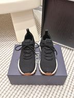 Black Dior unisex sneakers with lace-up front and white rubber sole